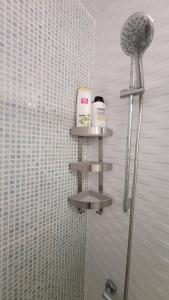 a shower with two shelves in a bathroom at APARTAMENTS B O D CoLLBLANC in Hospitalet de Llobregat +78 photos