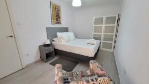 A bed or beds in a room at APARTAMENTS B O D CoLLBLANC