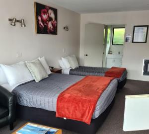 Postel nebo postele na pokoji v ubytování Arran Motel