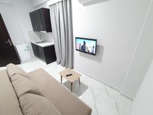 TV a/nebo společenská místnost v ubytování IL MIO