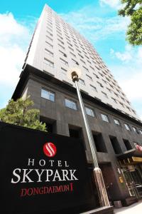 a hotel sky park sign in front of a building at Hotel Skypark Dongdaemun I in Seoul