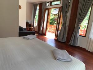 Voodi või voodid majutusasutuse Padi Ecolodge toas