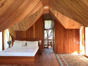 Voodi või voodid majutusasutuse Padi Ecolodge toas