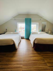Postel nebo postele na pokoji v ubytování Dalat Eco Hotel