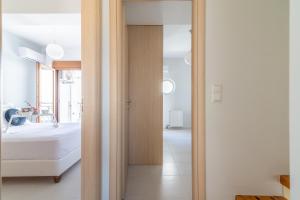 A bed or beds in a room at Trinity Seaside Family Maisonette