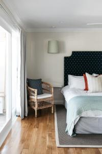 Ένα ή περισσότερα κρεβάτια σε δωμάτιο στο The Patonga Hotel