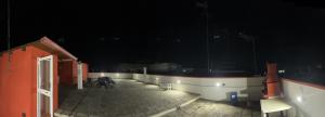 a group of chairs sitting on a patio at night at CASA DI KEKKO in Mesagne