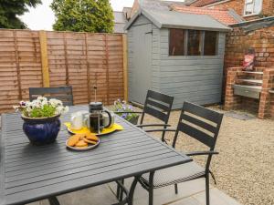 a black picnic table with a tea set on it at The Old Church in York