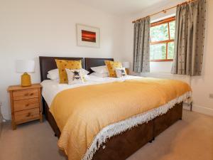a bedroom with a large bed and a window at Tresawle in Newquay