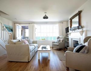 a living room with two couches and a coffee table at Castaway in Port Isaac