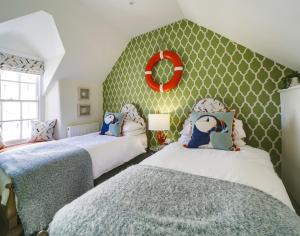 Cama ou camas em um quarto em Rose Cottage