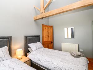 Un pat sau paturi într-o cameră la Crakesmire House