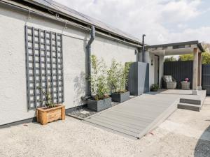 a backyard with a wooden deck and a building at Westfields in Launceston
