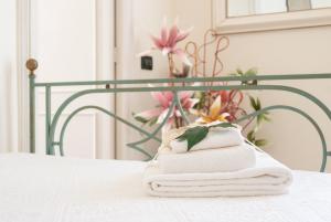 Posteľ alebo postele v izbe v ubytovaní B&B Risveglio col Rosone