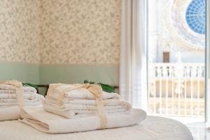 Posteľ alebo postele v izbe v ubytovaní B&B Risveglio col Rosone