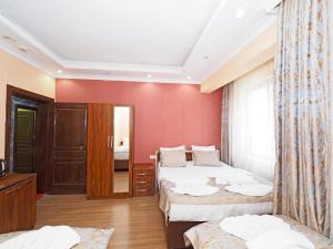 Postel nebo postele na pokoji v ubytování RENOVA hOTEL FATİH