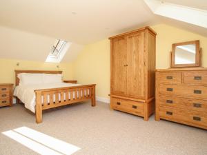 Voodi või voodid majutusasutuse The Stables, Burton Bradstock toas