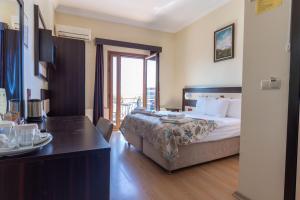 Кровать или кровати в номере Hotel Karacam