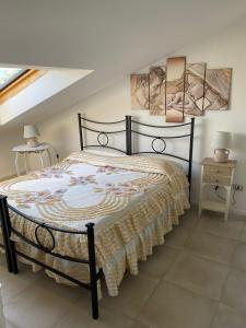 Кровать или кровати в номере Appartamento nel fabbricato denominato Il Castello