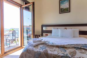 Кровать или кровати в номере Hotel Karacam