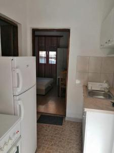a kitchen with a sink and a refrigerator at Apartment’s Maric - Zelenika,Herceg Novi in Zelenika