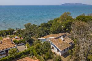 an aerial view of a house by the water at Villa Giannellina in Orbetello