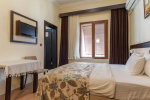 Кровать или кровати в номере Hotel Karacam