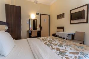 Кровать или кровати в номере Hotel Karacam