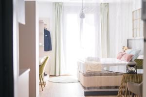a living room with a table and a couch at Boutique La Gloria 1908 by Expoholidays in Almería