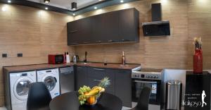 Kjøkken eller kjøkkenkrok på Wellness Apartment Kalypso