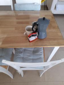 a coffee table with a coffee pot on it at Avra Studios in Masouri