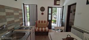 a kitchen with a sink and a counter top at House Irena in Budva