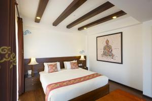 Letto o letti in una camera di Dalai-La Boutique Hotel