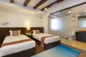 Letto o letti in una camera di Dalai-La Boutique Hotel
