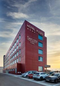 a hotel frio scientologist hotel with cars parked in front at Sercotel Plaza Feria in Zaragoza +60 photos