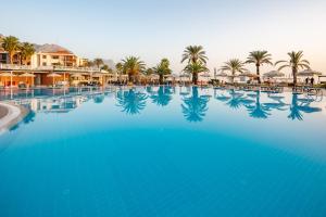 a view of the pool at a resort with palm trees at AQI Hydros Club in Kemer