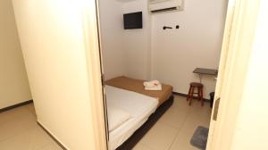 Postel nebo postele na pokoji v ubytování Hotel Seniman
