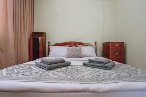 Postel nebo postele na pokoji v ubytování Villa Agava