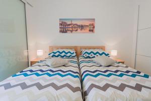 a bedroom with a bed with two pillows on it at Apartman Marica in Split