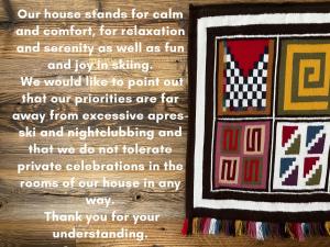 a page of a quilt with a picture of four squares at Hotel Andino in Sankt Anton am Arlberg