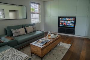 a living room with a couch and a coffee table at No 33 Stylish and Modern 1 Bed Apartment in Cheltenham