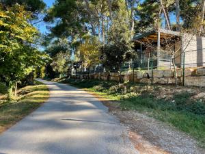 an empty road in front of a house at ROVINIA mobile home in Rovinj