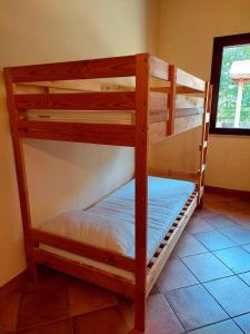 a couple of bunk beds in a room at Le Tre Dimore - Rifugio Aceroni in San Biagio Saracinesco