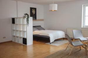 Tempat tidur dalam kamar di FullHouse - Eisenach - K70 Royal & Maximilian