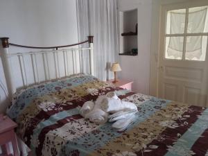 Postel nebo postele na pokoji v ubytování Villa Veloni Andros