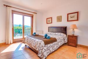 Postel nebo postele na pokoji v ubytování Finca SIONA Alcudia by Mallorca Villa Selection