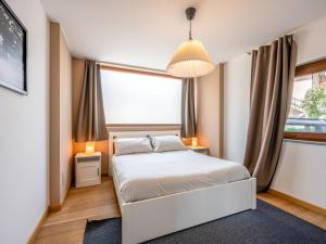 Postel nebo postele na pokoji v ubytování Apartment La Maison d'Amelie by Interhome