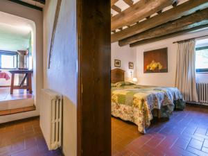 A bed or beds in a room at Apartment Bardeggiano - Caterina 2 - COL245 by Interhome