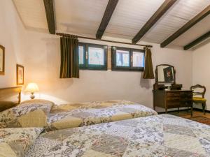 A bed or beds in a room at Apartment Bardeggiano - Caterina 2 - COL245 by Interhome