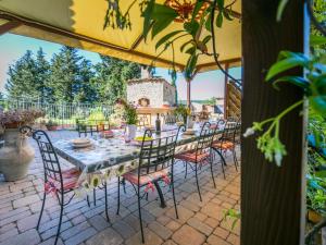 a table and chairs sitting on a patio at Holiday Home Metallo by Interhome in Colle Val D'Elsa